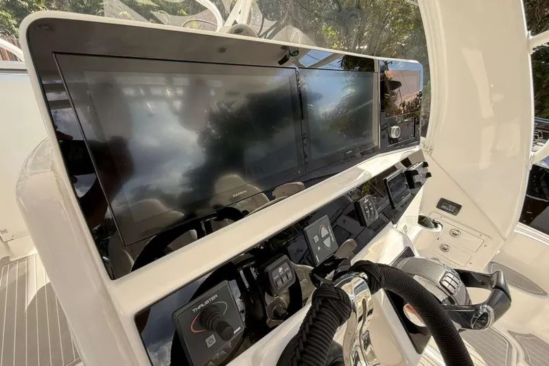Slide: The Image of 2008 Hydra-Sports Vector 3500 VX helm with advanced navigation displays and controls. - 52