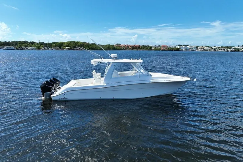 Slide: The Image of 2008 Hydra-Sports Vector 3500 VX boat on calm water under clear blue sky. - 8