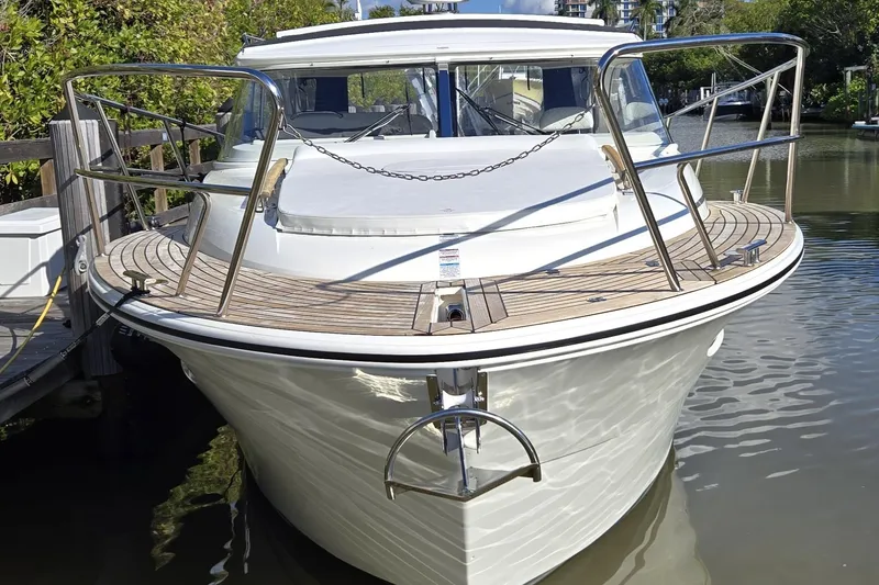 Slide: The Image of 2025 Marex 310 Sun Cruiser docked, showcasing sleek design and modern features. - 19