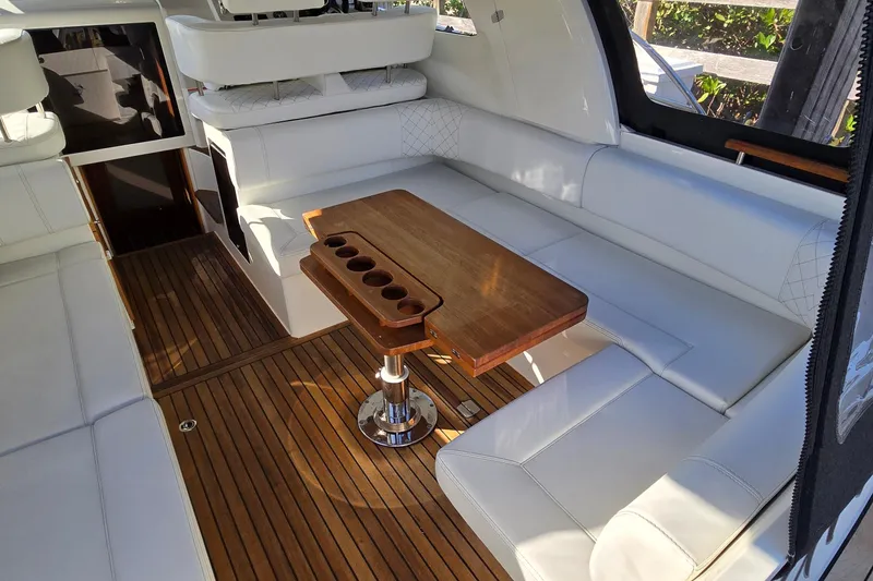 Slide: The Image of Luxurious interior of 2025 Marex 310 Sun Cruiser with elegant seating and wooden table. - 29