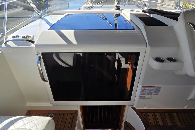 Slide: The Image of 2025 Marex 310 Sun Cruiser cockpit with sleek design and modern features. - 34