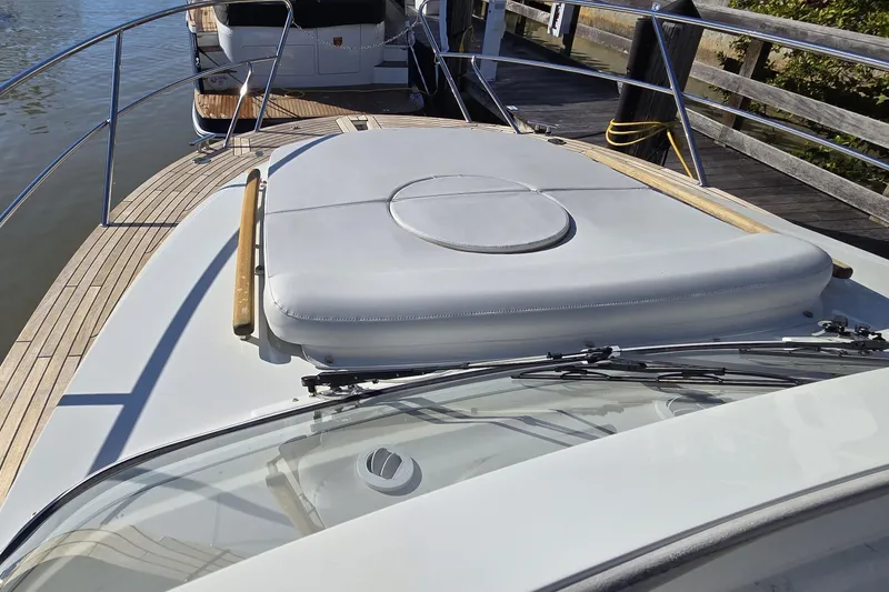 Slide: The Image of 2025 Marex 310 Sun Cruiser yacht with sleek deck design at dock. - 40