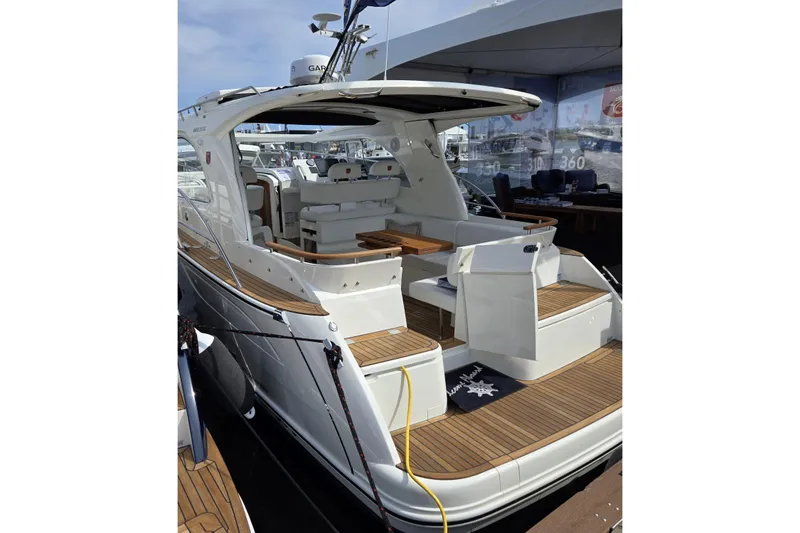 Slide: The Image of 2025 Marex 310 Sun Cruiser yacht with sleek design and spacious deck. - 5