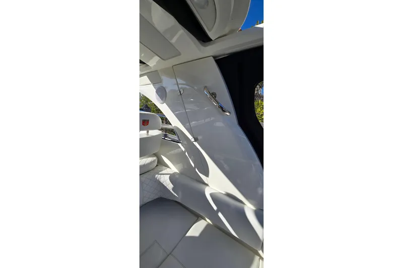 Slide: The Image of 2025 Marex 310 Sun Cruiser interior with sleek white design and modern features. - 55