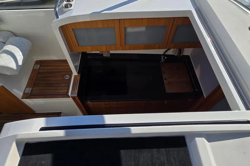 Slide: The Image of Modern kitchen area on 2025 Marex 310 Sun Cruiser yacht with sleek cabinetry. - 61
