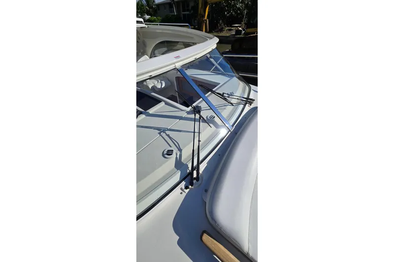Slide: The Image of 2025 Marex 310 Sun Cruiser windshield and wiper detail in sunlight. - 66