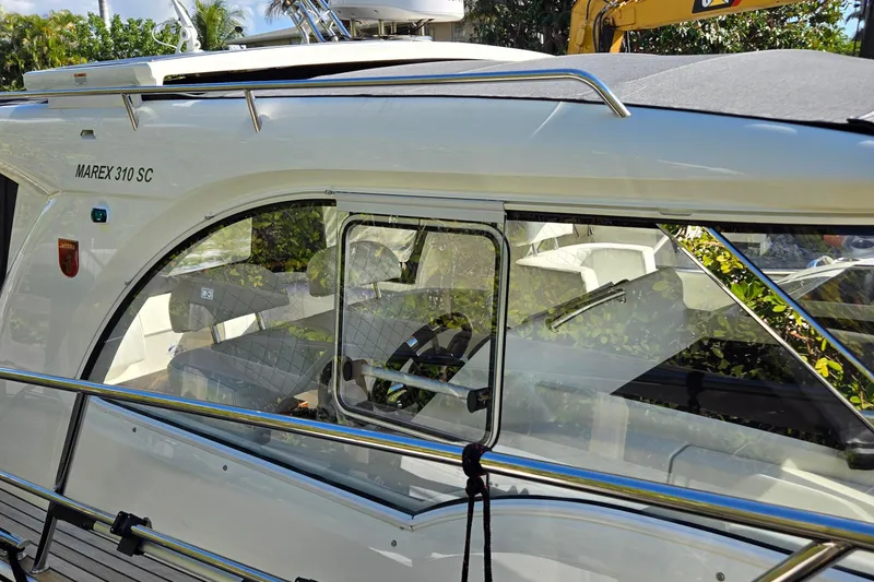 Slide: The Image of 2025 Marex 310 Sun Cruiser boat with sleek design and modern features. - 67