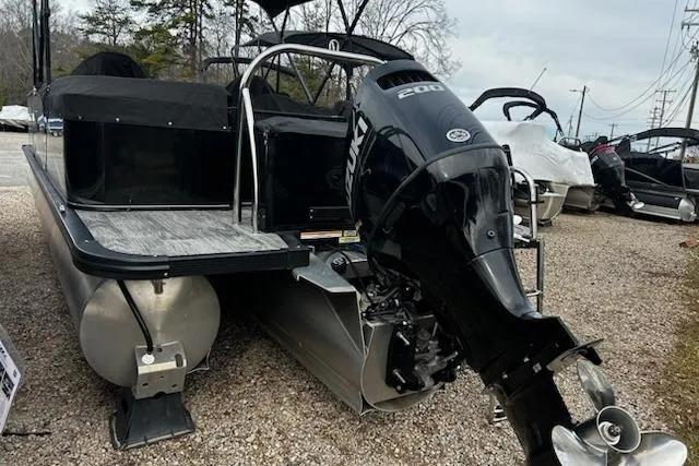Slide: The Image of 2022 Tahoe Pontoon LTZ Quad Lounger with Suzuki 200 engine, parked on gravel. - 4