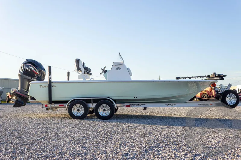 Slide: The Image of 2026 Tidewater 2110 Bay Max boat on trailer, side view, outdoors. - 22