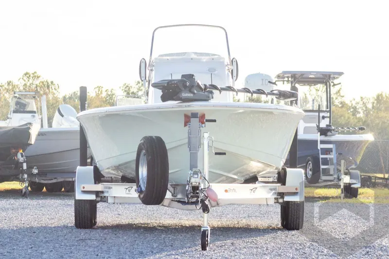 Slide: The Image of 2026 Tidewater 2110 Bay Max boat on trailer, parked outdoors in a lot. - 3
