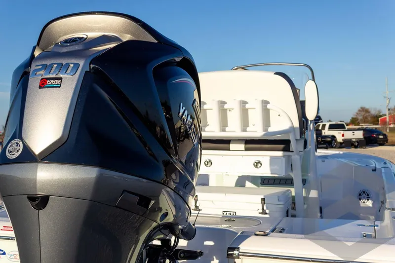 Slide: The Image of 2026 Tidewater 2110 Bay Max boat with Yamaha 200 engine, parked outdoors. - 32