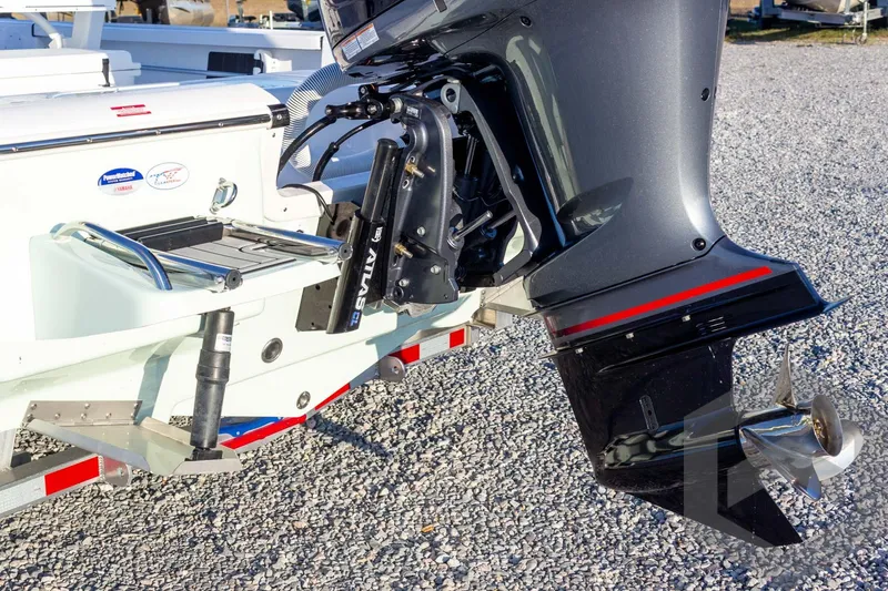 Slide: The Image of 2026 Tidewater 2110 Bay Max boat engine and propeller on gravel surface. - 36