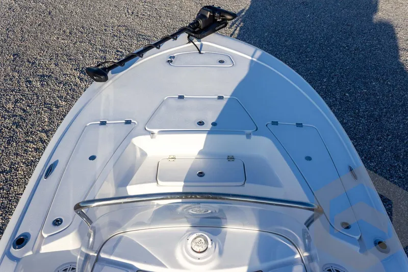 Slide: The Image of 2026 Tidewater 2110 Bay Max boat deck with storage compartments and trolling motor. - 38
