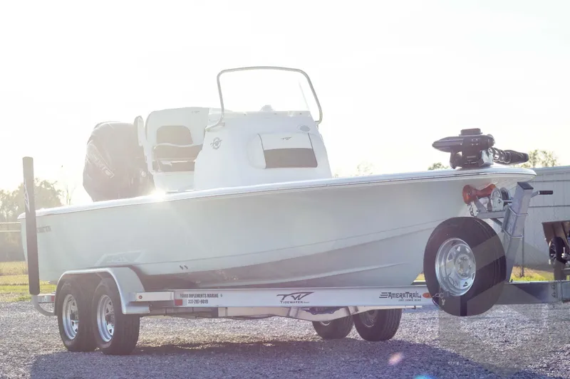 Slide: The Image of 2026 Tidewater 2110 Bay Max boat on trailer, sunlit background. - 4