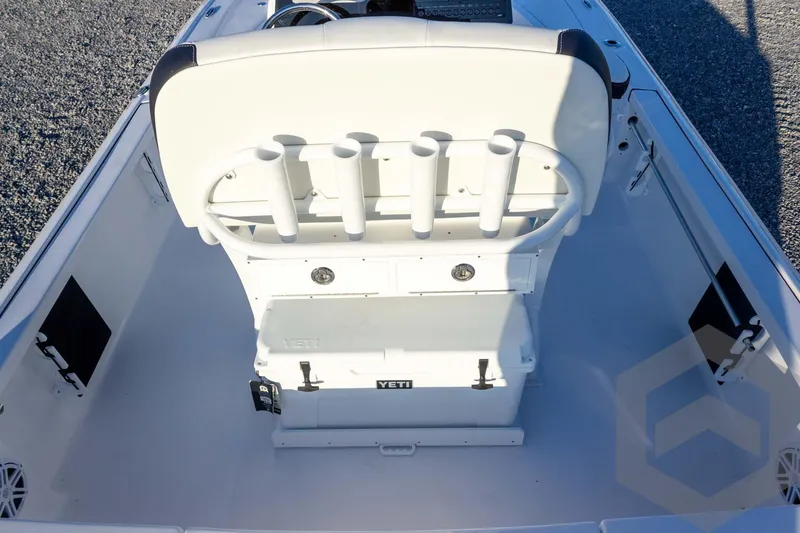 Slide: The Image of 2026 Tidewater 2110 Bay Max boat interior with rod holders and Yeti cooler. - 46