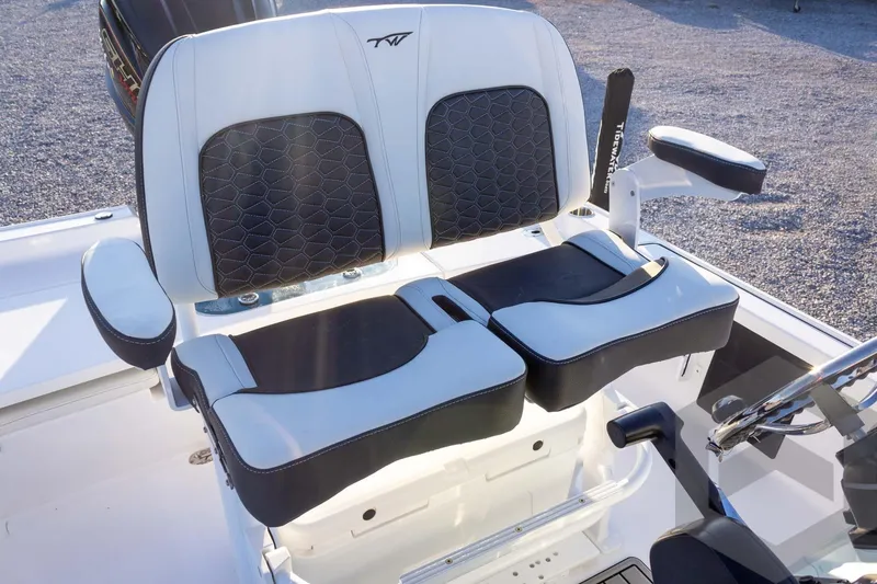 Slide: The Image of 2026 Tidewater 2110 Bay Max boat seating with black and white cushioned design. - 48
