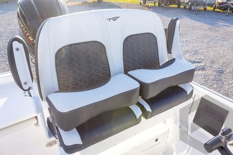 Slide: The Image of 2026 Tidewater 2110 Bay Max boat seats with black and white cushioned design. - 49
