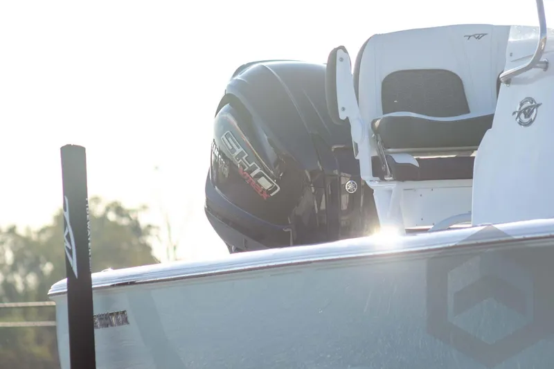 Slide: The Image of 2026 Tidewater 2110 Bay Max boat with Yamaha outboard engine in sunlight. - 5