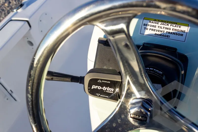 Slide: The Image of Steering wheel and controls of 2026 Tidewater 2110 Bay Max boat. - 58