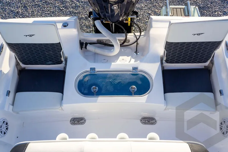 Slide: The Image of 2026 Tidewater 2110 Bay Max boat interior with seating and storage compartments. - 62