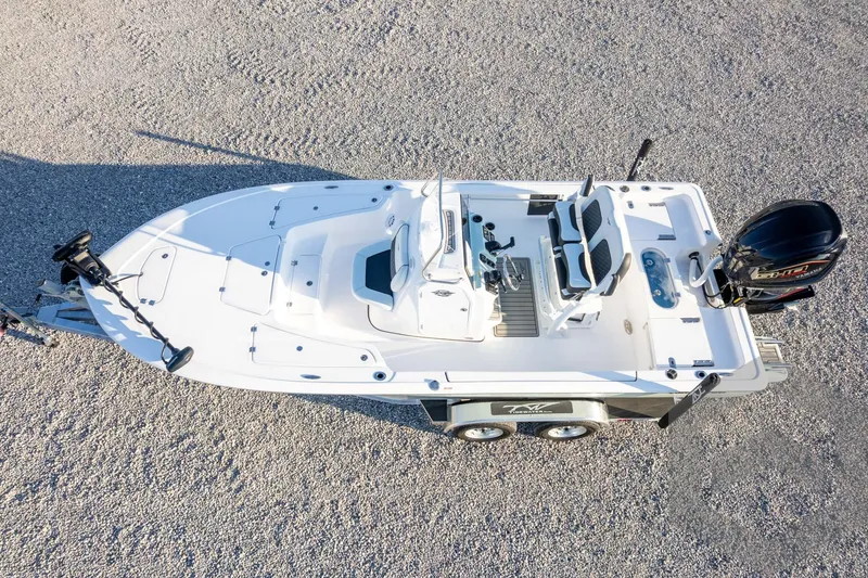 Slide: The Image of 2026 Tidewater 2110 Bay Max boat on trailer, aerial view, parked on gravel. - 68