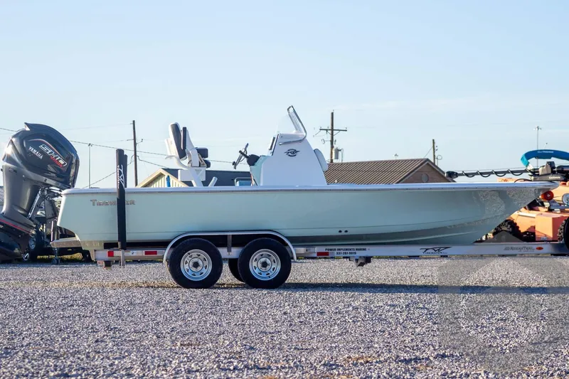 Slide: The Image of 2026 Tidewater 2110 Bay Max boat on trailer, side view, outdoors. - 7