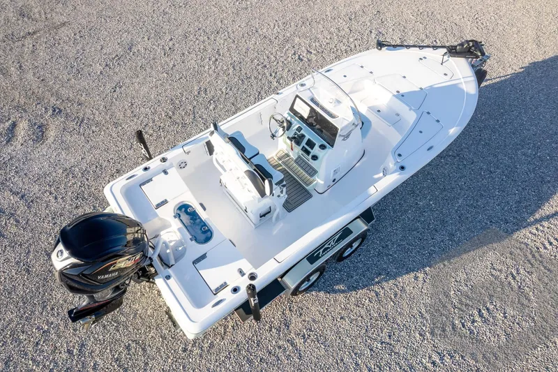 Slide: The Image of 2026 Tidewater 2110 Bay Max boat with Yamaha engine on gravel surface. - 71