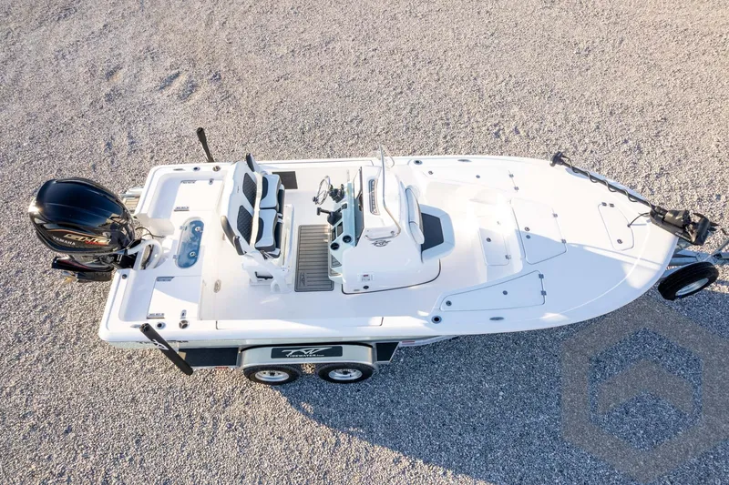 Slide: The Image of 2026 Tidewater 2110 Bay Max boat on trailer, aerial view, parked on gravel. - 72