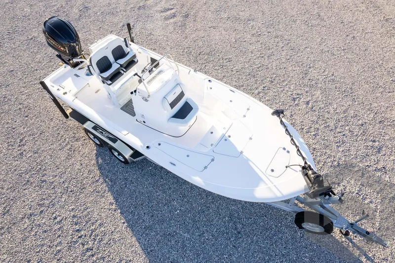 Slide: The Image of 2026 Tidewater 2110 Bay Max boat on trailer, aerial view, parked on gravel. - 73