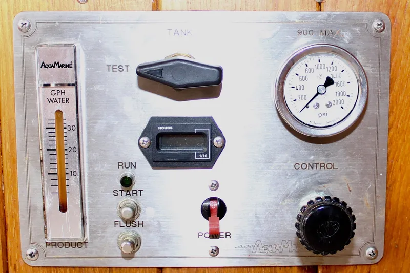 Slide: The Image of Control panel of a 1975 William Garden Porpoise boat with gauges and switches. - 22