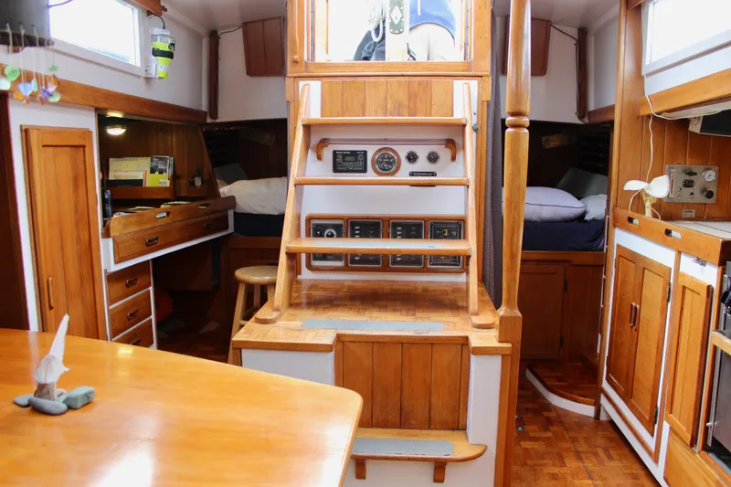 Slide: The Image of 1975 William Garden Porpoise yacht interior with wooden cabinetry and nautical instruments. - 23