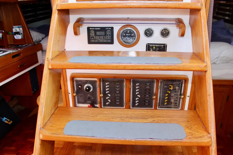 Slide: The Image of 1975 William Garden Porpoise yacht interior with control panels and wooden steps. - 24