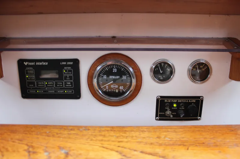 Slide: The Image of Control panel of a 1975 William Garden Porpoise boat with gauges and switches. - 25
