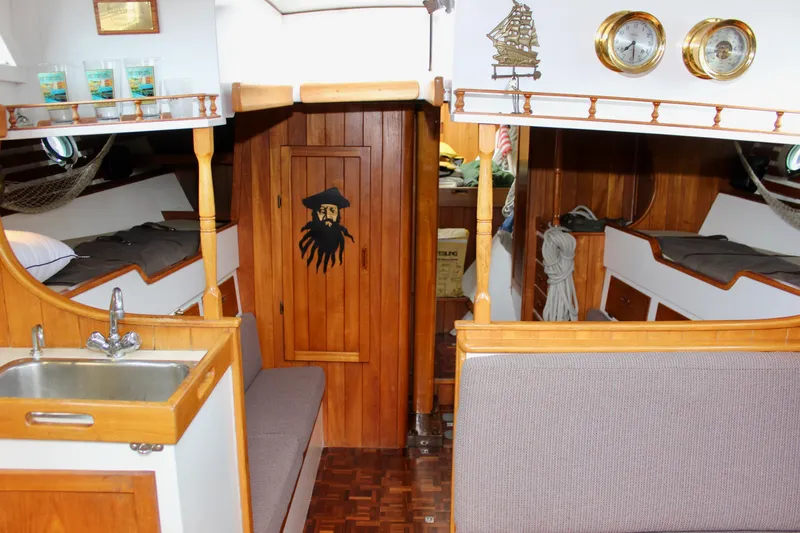Slide: The Image of Interior of 1975 William Garden Porpoise sailboat with wooden decor and nautical accents. - 35