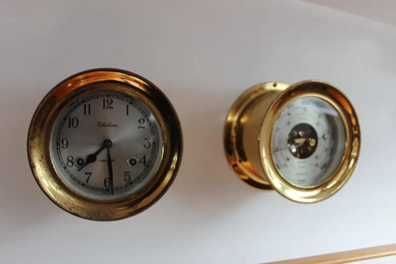 Slide: The Image of Brass clock and barometer on William Garden Porpoise, 1975 model yacht interior. - 36