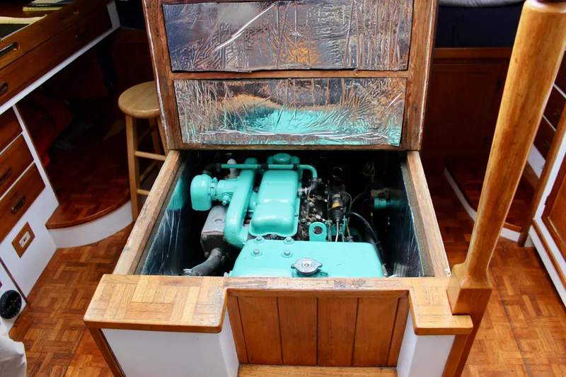Slide: The Image of 1975 William Garden Porpoise engine in wooden cabin interior. - 54