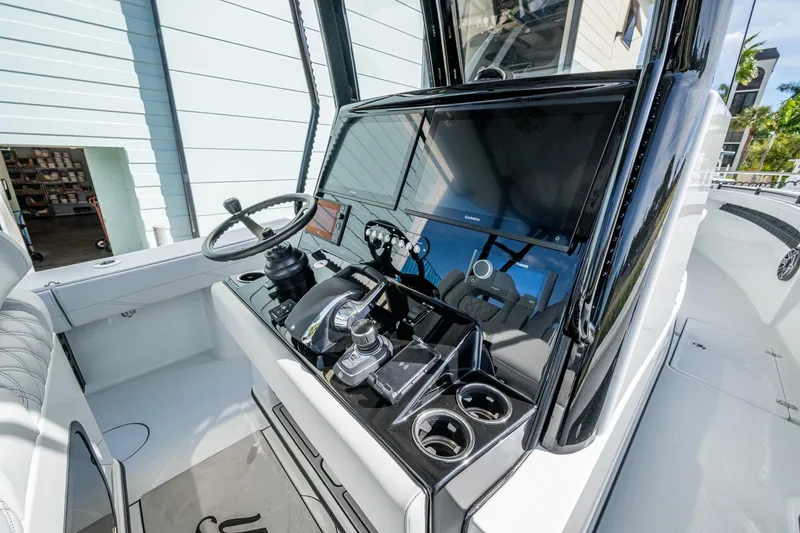 Slide: The Image of 2026 Yellowfin 36 Offshore boat cockpit with modern controls and sleek design. - 10