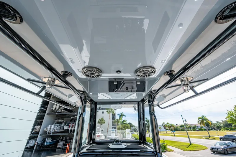Slide: The Image of 2026 Yellowfin 36 Offshore boat interior with speakers and sleek design. - 11