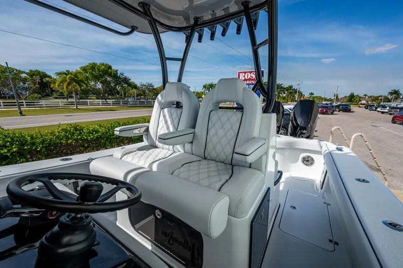 Slide: The Image of 2026 Yellowfin 36 Offshore boat interior with luxurious seating and steering wheel. - 12