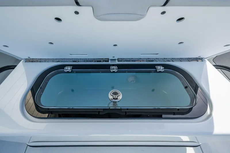 Slide: The Image of Livewell compartment on 2026 Yellowfin 36 Offshore boat, open lid view. - 18