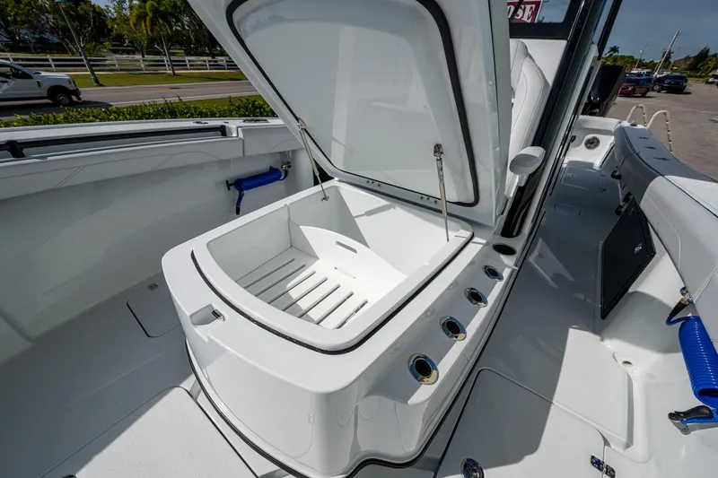 Slide: The Image of 2026 Yellowfin 36 Offshore boat interior with open storage compartment. - 20