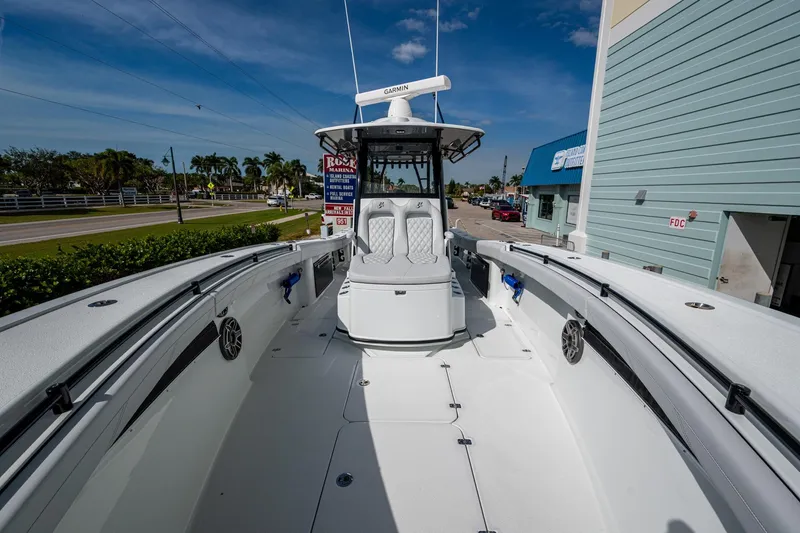 Slide: The Image of 2026 Yellowfin 36 Offshore boat docked, showcasing spacious deck and modern design. - 26