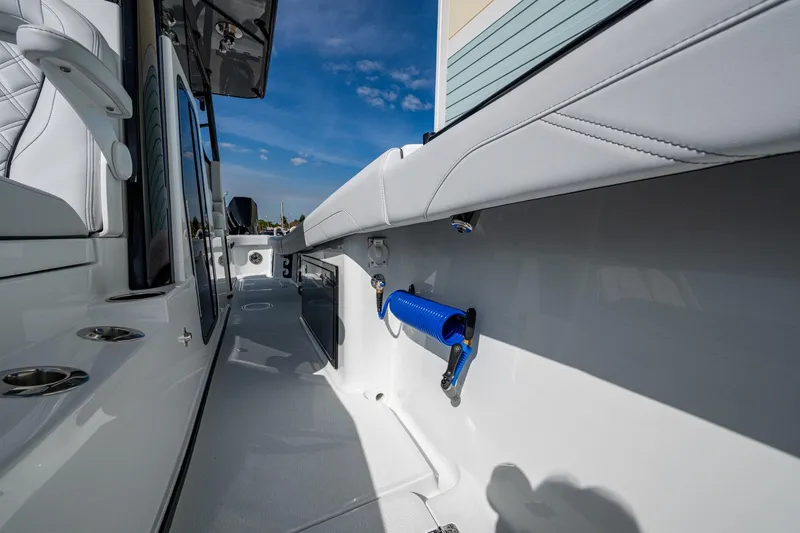 Slide: The Image of 2026 Yellowfin 36 Offshore boat deck with sleek design and blue hose attachment. - 27