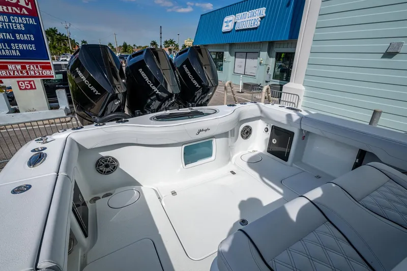Slide: The Image of 2026 Yellowfin 36 Offshore boat with triple Mercury engines at a marina. - 35