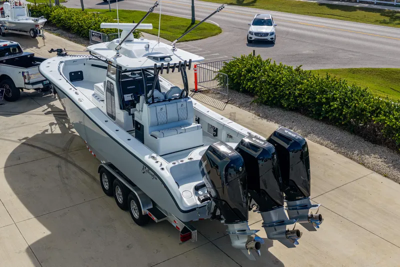 Slide: The Image of 2026 Yellowfin 36 Offshore boat with triple outboard engines on a trailer. - 4