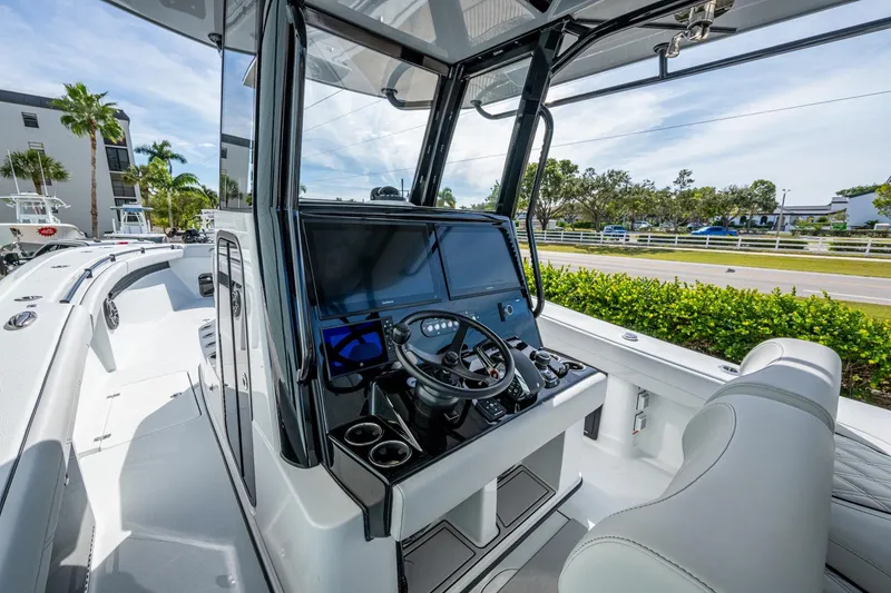 Slide: The Image of 2026 Yellowfin 36 Offshore boat cockpit with modern navigation system and sleek design. - 6