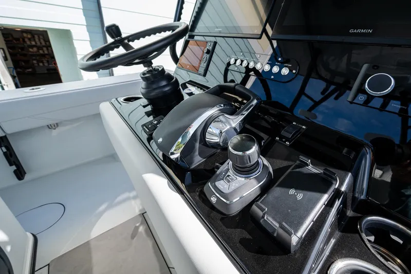 Slide: The Image of 2026 Yellowfin 36 Offshore boat helm with advanced controls and Garmin displays. - 9