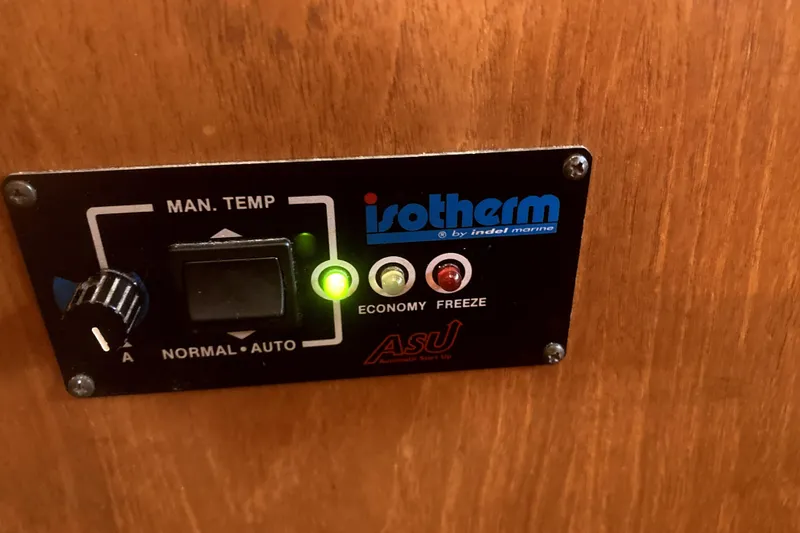 Slide: The Image of Isotherm control panel on 1984 Nauticat 33 boat, featuring manual temperature settings. - 36