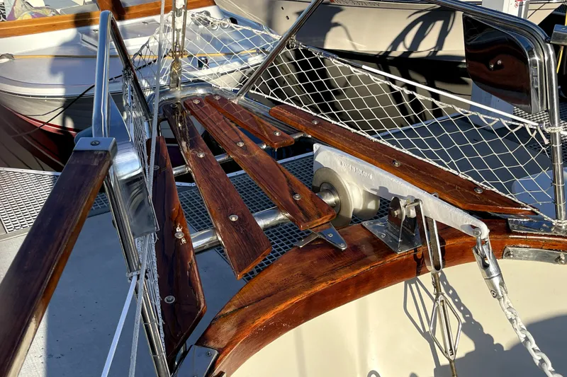 Slide: The Image of Nauticat 33 sailboat bow with wooden deck and metal fittings, 1984 model. - 41