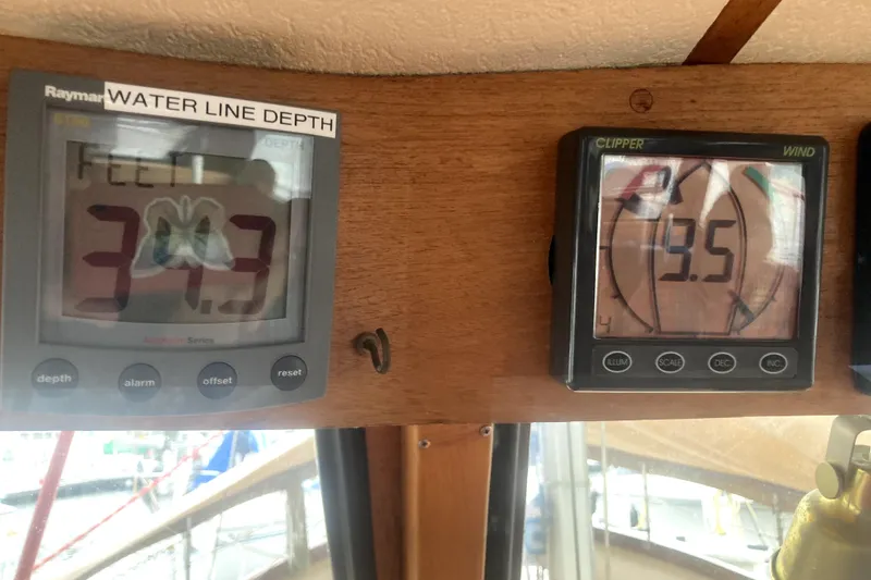 Slide: The Image of Depth and wind gauges on a 1984 Nauticat 33 boat, showing 34.3 feet and 3.5 knots. - 42